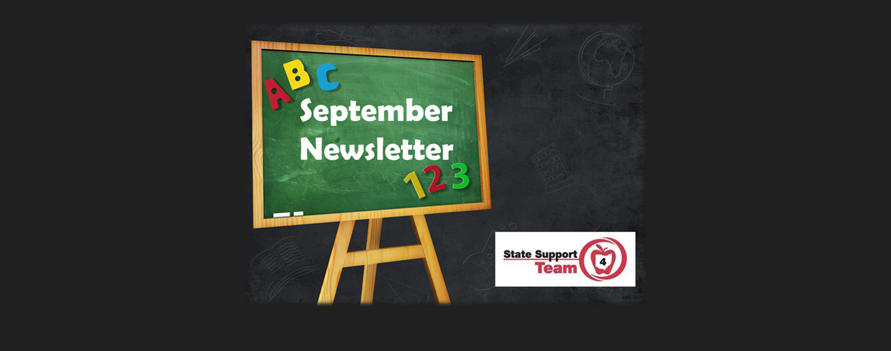 Chalkboard with September Newsletter written on it. Black background. 